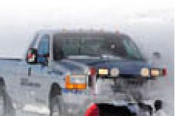 Bridgestone Winter Driving School managers follow their own advice on winter prep, equipping their pickups with dedicated snow tires for plowing miles of roads outside of Colorado Springs, Colo.