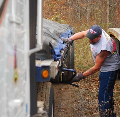 Dan Heister adjust flatbed landing gear