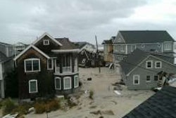 This is the collapsed home (in the photo’s center) along the New Jersey shore of the mother of a Randall-Reilly Construction Media Division’s friend. Better Roads is part of this division.