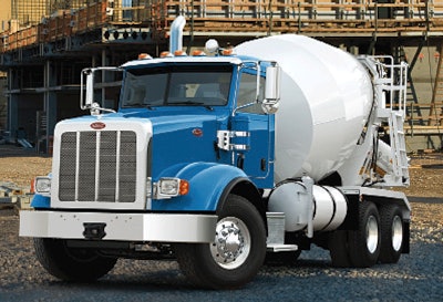 Peterbilt’s Model 365 is available in both set-forward and set-back front axle configurations. It can be built as a day cab or with a Unibilt sleeper and is available with four engine configurations with up to 485 horsepower.