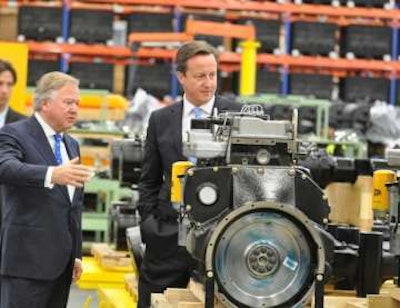 JCB chairman Sir Anthony Bamford shows the JCB Dieselmax engine to Prime Minister David Cameron during his visit to JCB.