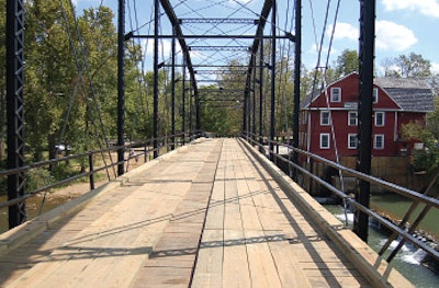 Steve Beam’s first bridge project was the War Eagle Bridge, which carries County Route 98 across War Eagle Creek in Benton County, Arkansas. It was listed on the National Register of Historic Places in 1985.
