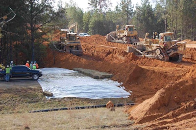 As soon as Mr. Tom cross the road, the dozers went to work pushing back the dirt berm.