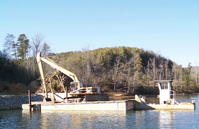 To work on sites too steep to reach by land, Bennick started a barge operation to open up home sites on a nearby lake.