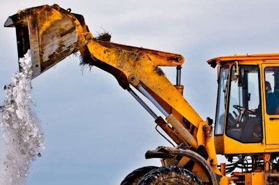 wheel loader dumping snow stock