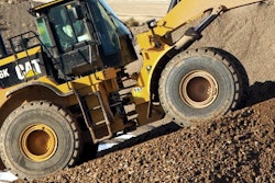 Cat-966K-handles-gravel-wide-shot-C648952-e1354714234598