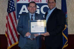 AGC New York president and CEO Michael Elmendorf, left, receives an award for military support from his employee Navy Reserve Lt. Carl Zielman. Credit: timesunion.com.