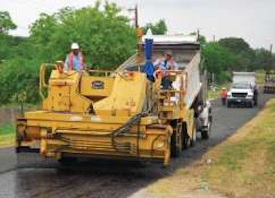 In Bexar County, Tex., 3/8-inch crushed basalt chips immediately follow placement of cationic, high-float, rapid-set emulsion; county was 2012 winner of FP2’s James B. Sorenson Award for Excellence in Pavement Preservation