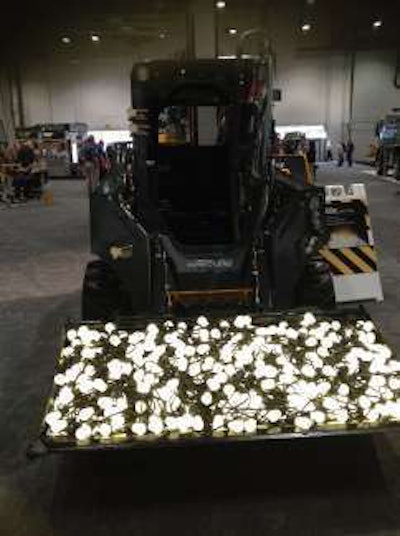 John Deere Forestry and Construction filled the bucket of the machines in one of its new E Series with light bulbs signifying the “bright ideas” used to develop this series and its new 644K Hybrid wheel loader
