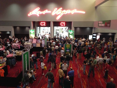 A crowd of World of Concrete 2013 attendees gather at the central exhibition hall of the Las Vegas Convention Center, waiting for the show floor to open for the day.
