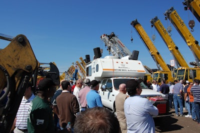 A mobile truck conducts auctions on the yard for equipment that’s too big to run by the reviewing stands.