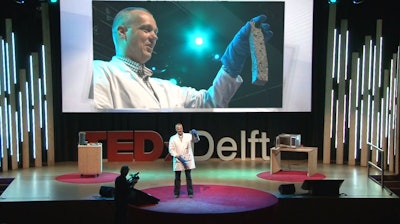 Dutch researcher Erik Schlangen demonstrates self-healing asphalt during a TED talk.