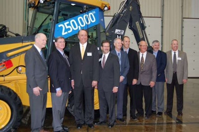 Members of the Deere and NPL teams at the 250,000th backhoe event. At left, Mike Mack, Deere Construction & Forestry president, and Jim Kane, president and CEO of NPL Construction.