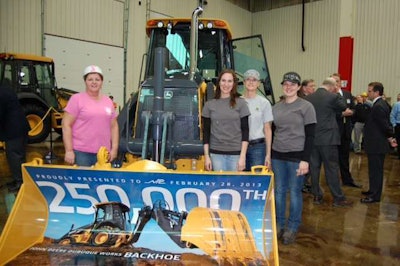 John Deere production workers at the 250,000th backhoe event.