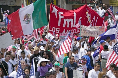Hundreds of thousands of immigrants participate in a march for Immigrants and Mexicans protesting against Illegal Immigration reform by U.S. Congress in Los Angeles in 2006. Credit: Spirit of America / Shutterstock.com