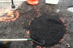 Aquaphalt’s asphalt alternative for filling potholes is installed during a test in Boston.