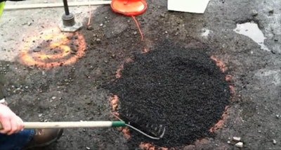 Aquaphalt’s asphalt alternative for filling potholes is installed during a test in Boston.