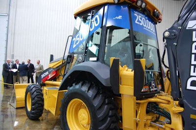 The 250,000 John Deere backhoe is the 310SK pictured. It was presented to NPL Construction who primarily buys its equipment from Deere.