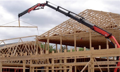 Setting trusses is considered new construction and since they are not sheet goods or packaged goods this job requires a certified operator.