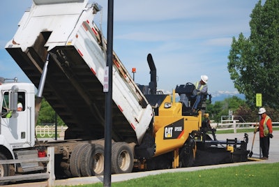 Cat’s 8-foot AP55E paver has a large capacity hopper.