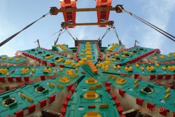 Big Bertha’s cutterhead being lowered into place last year for the start of her dig beneath Seattle.