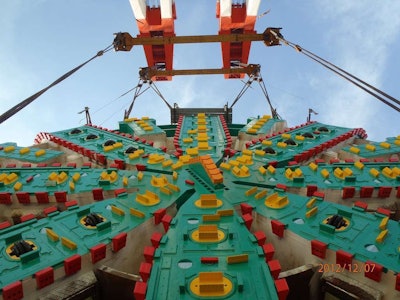 Big Bertha’s cutterhead being lowered into place last year for the start of her dig beneath Seattle.