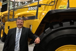 Bell’s Neville Paynter in front of North America’s largest articulated truck, the B50D