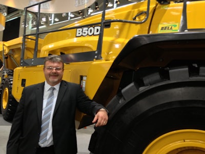 Bell’s Neville Paynter in front of North America’s largest articulated truck, the B50D