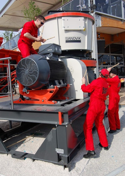 Sandvik organized a trio of drummers to regale the crowd with a “Stomp” like performance on it’s new CH550 cone crusher.