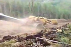 That blur of dust and yellow iron is a pipelayer that’s decided to make its way down the mountain.