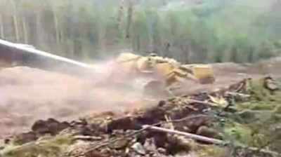 That blur of dust and yellow iron is a pipelayer that’s decided to make its way down the mountain.