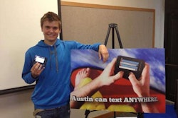Austin Wierschke poses with a new Wisconsin advertisement. (Photo: Gannett Wisconsin Media)