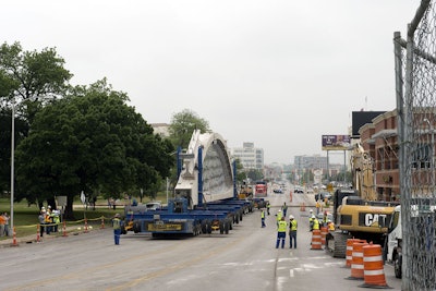 The bridge segments are lowered onto wheeled cribbing for the short ride to their final destination.