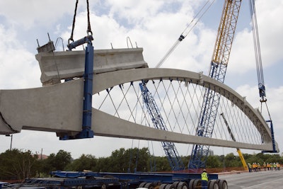 Powerlift. Each arched segment weighs 300 tons.