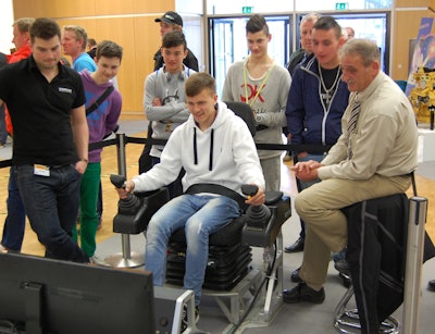 Teens at Bauma 2013’s Think Big event were encouraged to try their hand at equipment simulators.