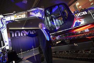 JCB Chairman Sir Anthony Bamford stands by the company’s one millionth machine.
