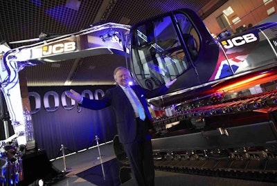 JCB Chairman Sir Anthony Bamford with the company’s 1 millionth machine, a JS220 tracked excavator.