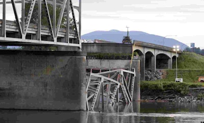 A portion of the I-5 bridge collapsed into the Skagit River in Washington State in May. (Photo: AP/Elaine Thompson via The Huffington Post)