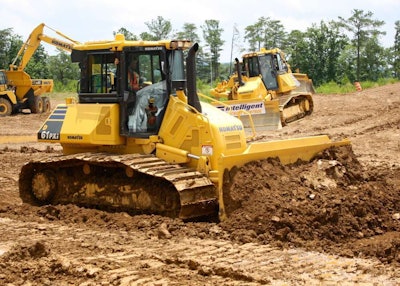 The D61i-23 was the first Komatsu machine released with Intelligent Machine Control. The technology offers semi-automatic control of dozers and excavators now, but Komatsu is now using it to power a new business that fully automates jobsites.