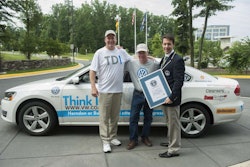 Primary driver Wayne Gerdes, left, Bob Winger and Guinness World Records adjudicator Philip Robertson with the Passat TDI. Credit: Volkswagen