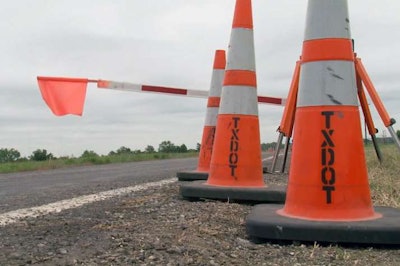 An Automated Flagger Assistance Device is seen in the lowered position. The Texas DOT has begun using the devices to keep flaggers at a safe distance.