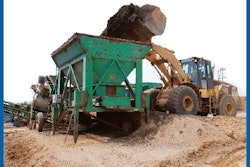 Reclaimed asphalt pavement (RAP) is fed to crushing circuit in advance of incorporation into warm asphalt mix.