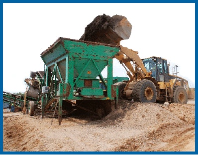 Reclaimed asphalt pavement (RAP) is fed to crushing circuit in advance of incorporation into warm asphalt mix.