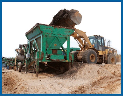 Reclaimed asphalt pavement (RAP) is fed to crushing circuit in advance of incorporation into warm asphalt mix.