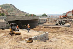 UDOT crews work on an I-84 overpass, using geosynthetic reinforcement and soil integration in place of steel pylons and concrete. (Photo: Jeffrey D. Allred, Deseret News)