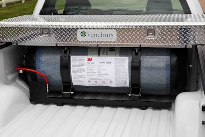 The CNG fuel tank is located behind the cab.