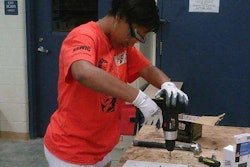 Shere Tolbert, 14, uses a drill at the Rosie’s Girls construction camp in Cincinnati. Credit: WCPO.com