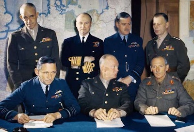General Eisenhower, seated center, with his staff of Allied military leaders during WWII. Credit: History.com