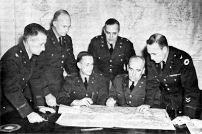 Eisenhower, standing second from left, during war planning in March of 1942.