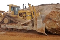 Caterpillar D11R pushing a rock